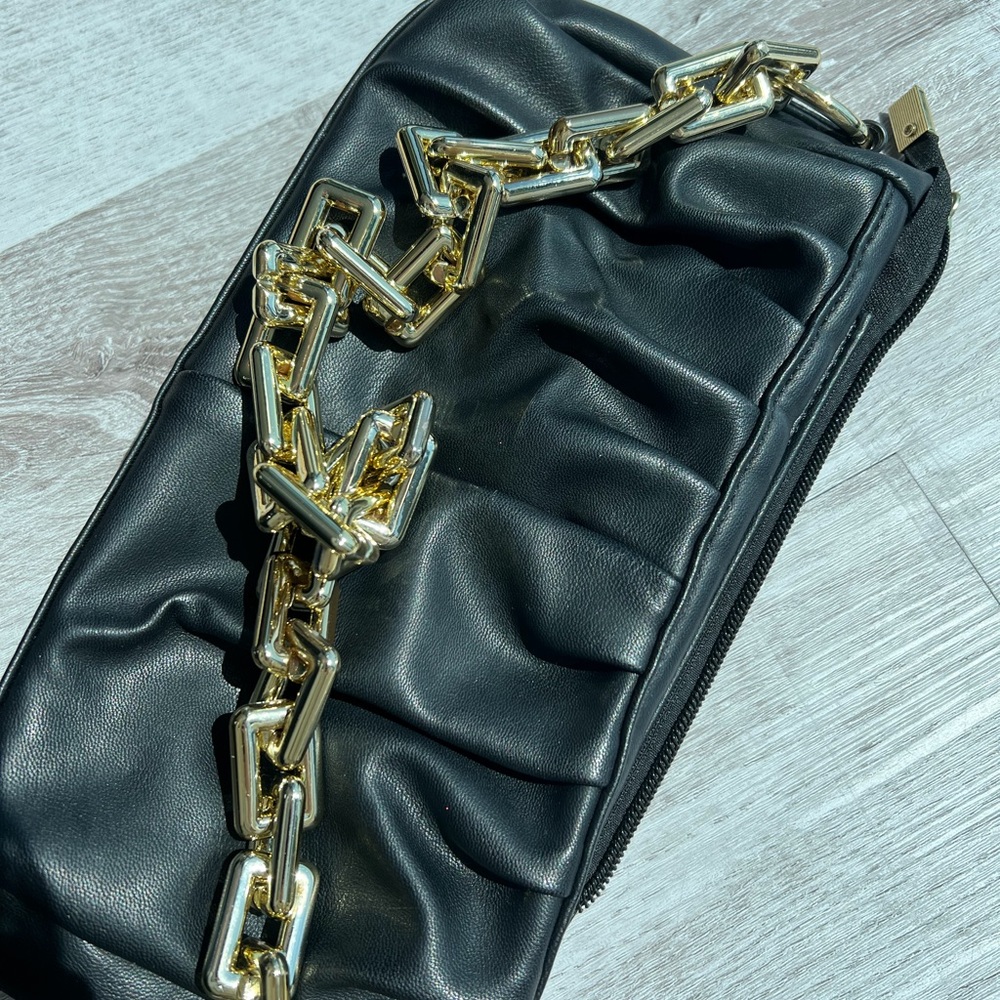 Black shoulder bag with gold chain